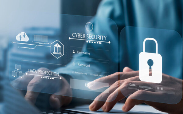 Mensch tippt auf einer Tastatur mit eingeblendeten holografischen Symbolen zu Cybersicherheit und Datenschutz, darunter ein Login-Fenster mit Benutzername und Passwort sowie ein Vorhängeschloss-Symbol