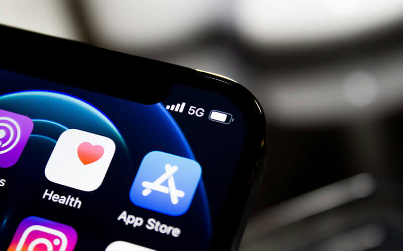 Apps such as the Health app and the App Store can be seen on an iPhone