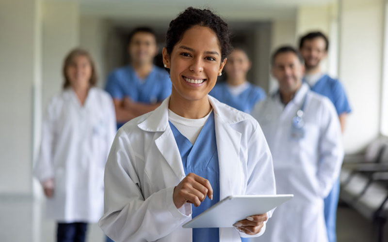 Several doctors in medical clothing work in the healthcare sector